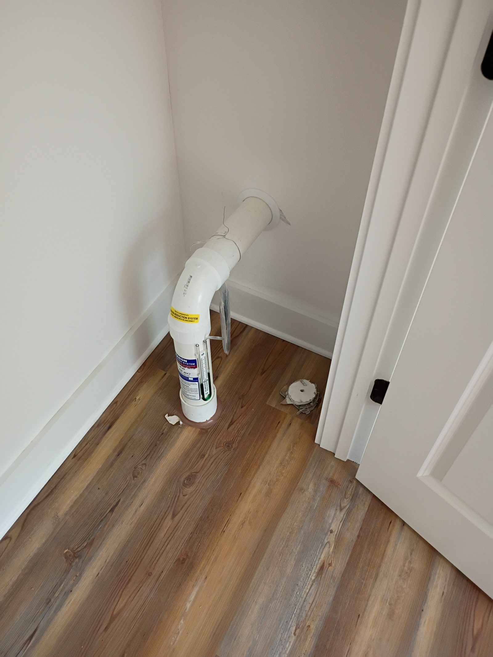 Finished interior radon pipe in a completed room