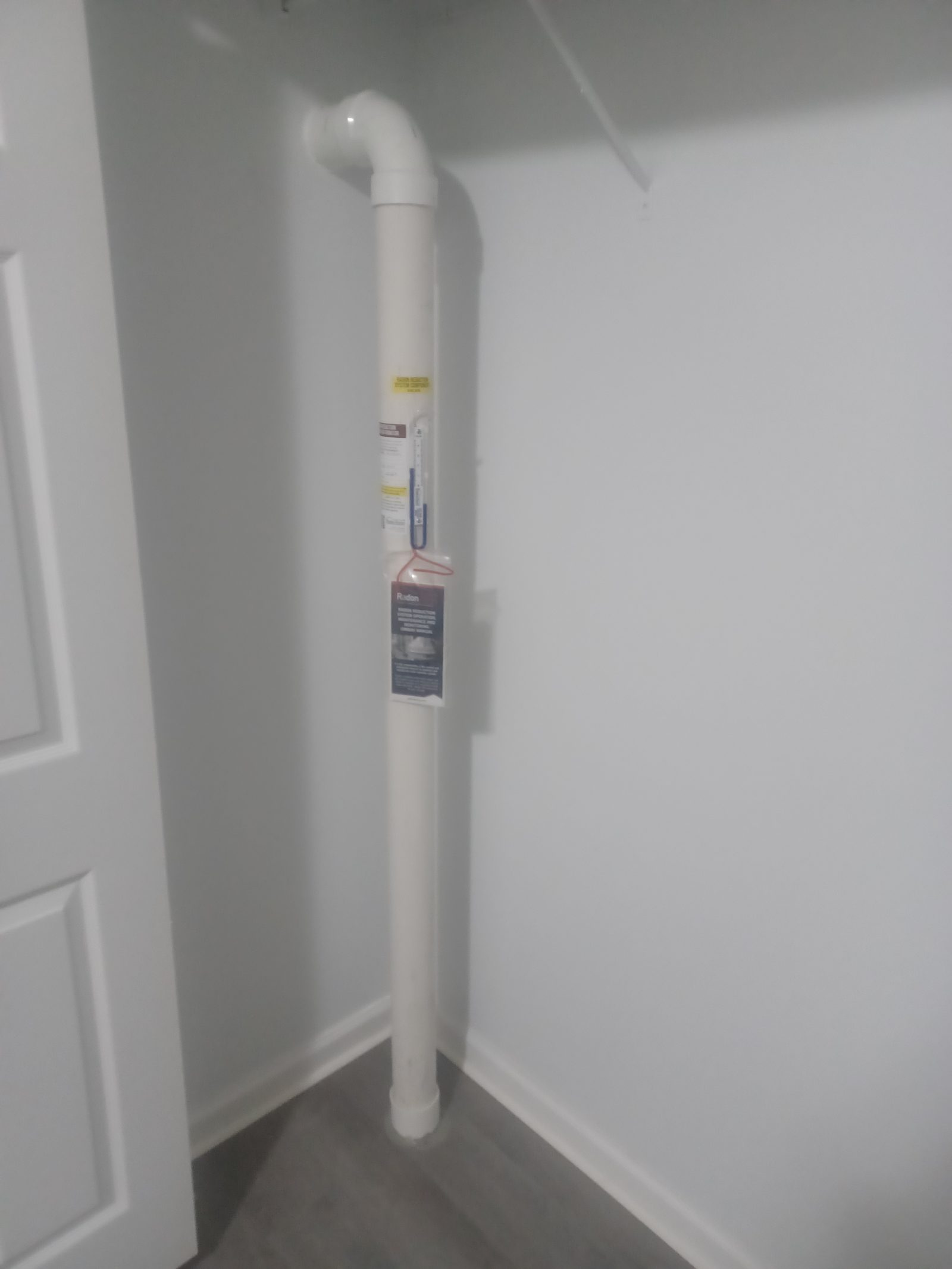 Interior radon pipe run through a finished closet
